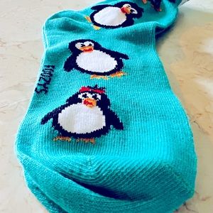 Quarter socks in teal with penguin pattern. One size.